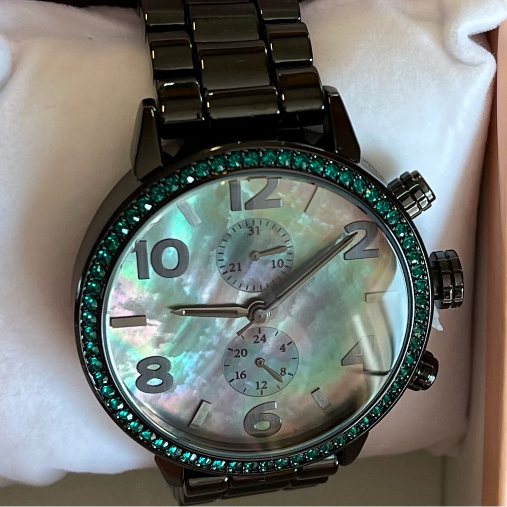 Diamonique black watch with green stones.